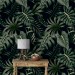 Dark tropical wallpaper with palm leaves