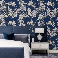 Tropical wallpaper palm leaves on dark blue